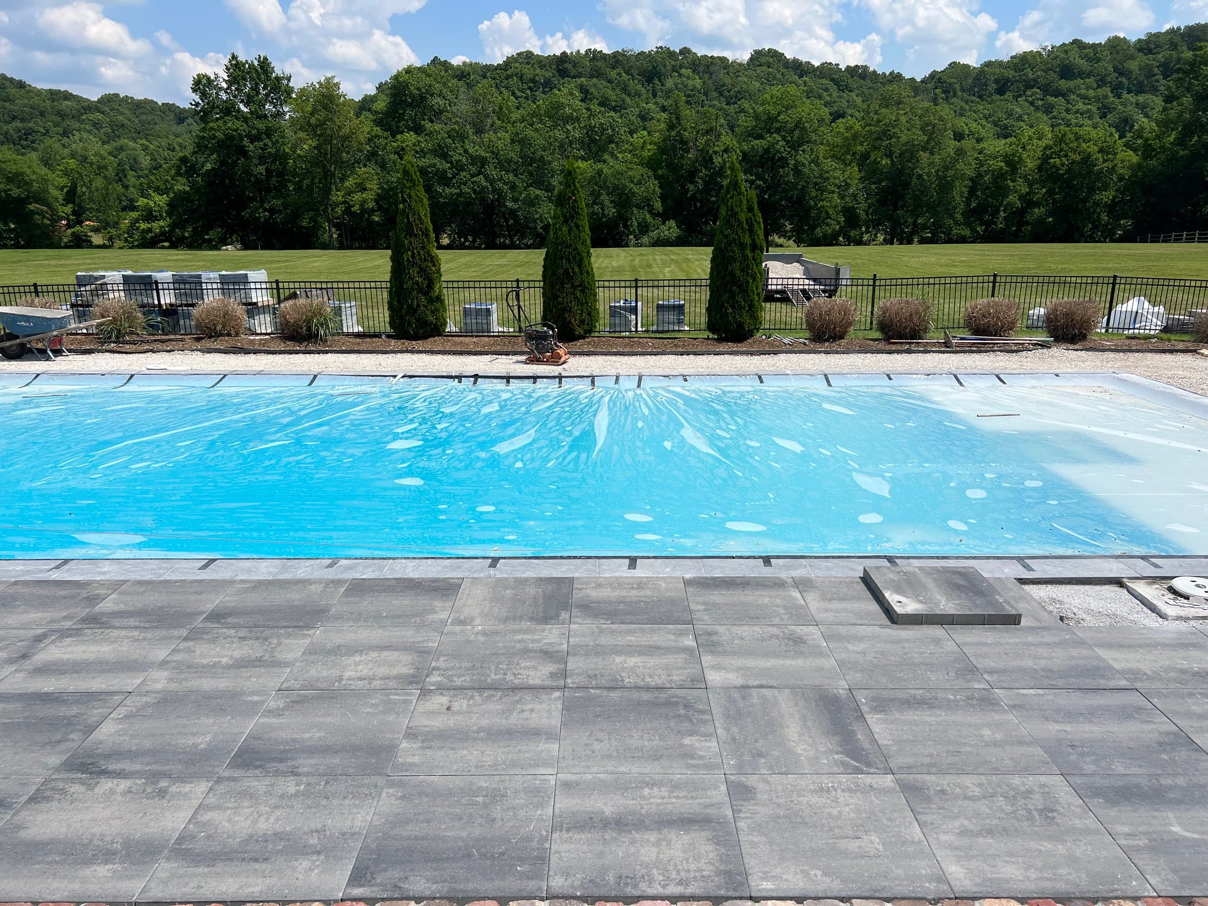 Pool with a full paver deck